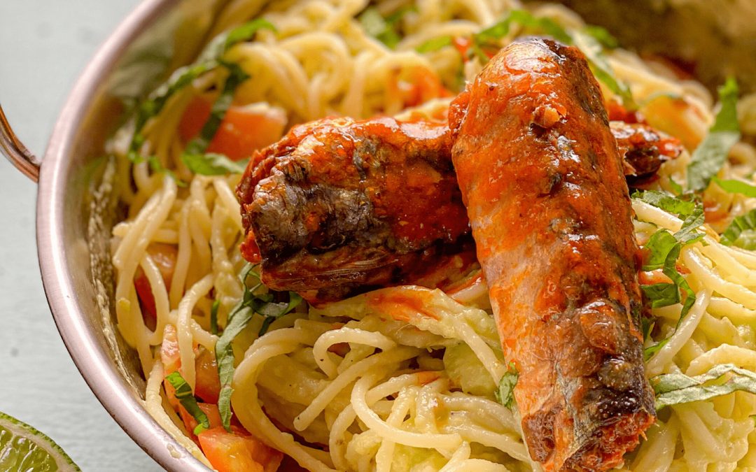Pasta with avocado and sardines in tomato sauce